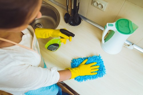 Staff member reviewing safety measures and cleaning procedures